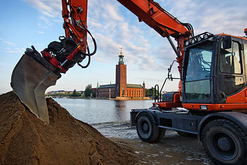 Image showing Excavator and the city hall