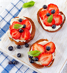 Image showing toasted bread with cream cheese and berries