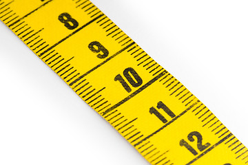 Image showing Yellow measuring tape isolated - selective focus