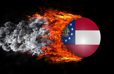 Image showing Flag with a trail of fire and smoke - Georgia