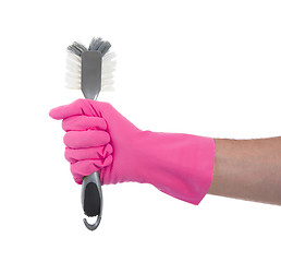 Image showing Protection glove holding a dish-brush