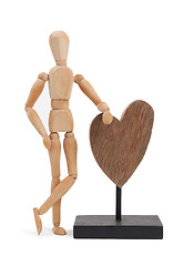 Image showing Wooden mannequin with a big heart