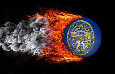 Image showing Flag with a trail of fire and smoke - Nebraska