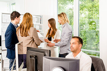 Image showing Businesspeople working in office