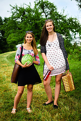 Image showing Two girls getting ready for a picnic