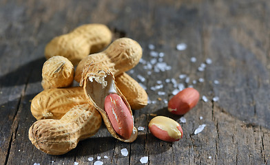 Image showing peanut isolated on wooden background