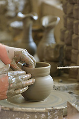 Image showing hands making clay pot