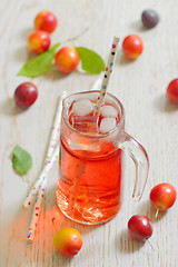 Image showing Plum compote and fresh plums with ice cubes