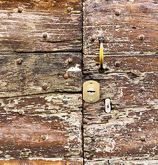 Image showing castellanza   knocker in a  door curch  closed    cross