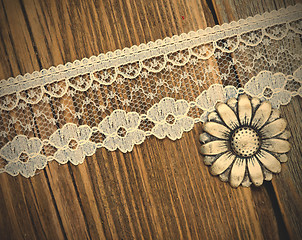 Image showing vintage button and lace tape