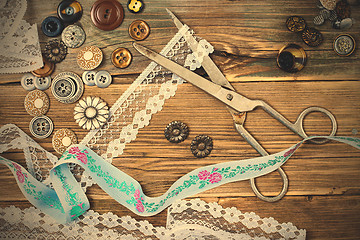 Image showing aged lace, vintage buttons and a dressmaker scissors
