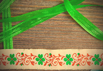Image showing vintage embroidered band and green tape