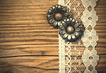 Image showing vintage metal buttons flowers and lace tape