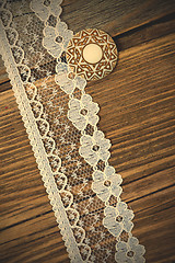 Image showing vintage button and lace tape