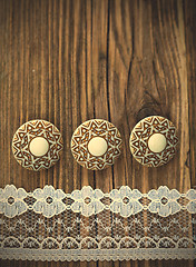 Image showing three vintage button and lace tape