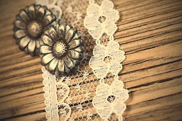 Image showing vintage button and lace tape