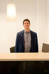 Image showing Young receptionist smiling