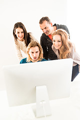 Image showing Abstract: Business team in office looking at computer monitor