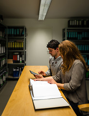 Image showing digitalization: young man and woman in the company archives