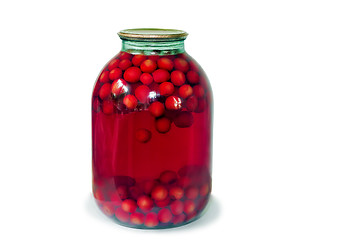 Image showing Home canning: glass cylinders with cherry compote on white backg