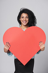 Image showing Girl holding big red heart shape