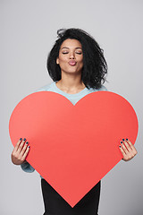 Image showing Girl holding big red heart shape