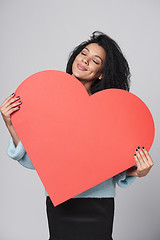 Image showing Girl holding big red heart shape