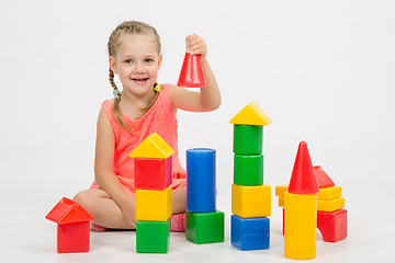 Image showing four-year child is having fun playing with blocks