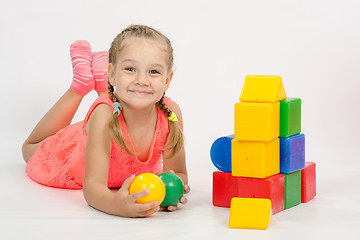 Image showing Happy child in the house out of blocks