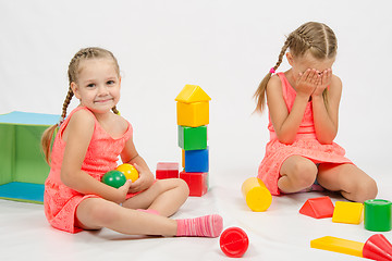 Image showing The girl took the toy offending other