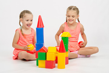 Image showing Two girls built a castle out of blocks