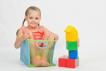 Image showing The child climbed indulging in a box for toys