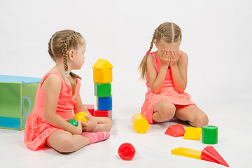 Image showing Girl hurt another girl playing with toys