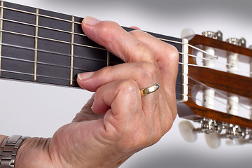 Image showing Old hand and guitar isolated