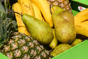 Image showing pears pineapples bananas in a wooden box
