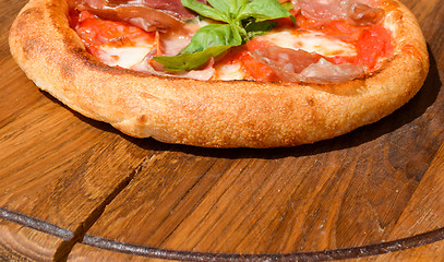 Image showing Fresh pizza on a thick dough
