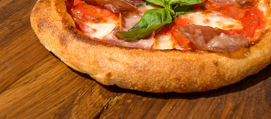 Image showing Fresh pizza on a thick dough