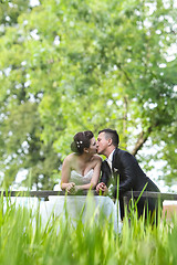 Image showing Newlyweds kissing 