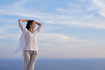 Image showing young woman enjoy sunset