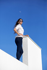 Image showing relaxed woman in front of luxury modern home