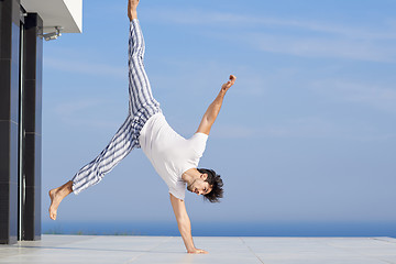 Image showing young man practicing yoga