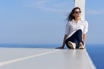 Image showing relaxed woman in front of luxury modern home