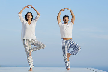 Image showing young couple practicing yoga