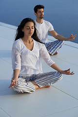 Image showing young couple practicing yoga