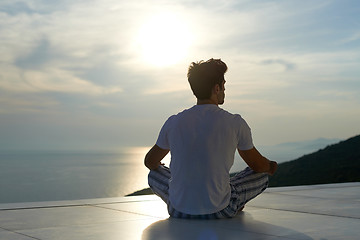 Image showing young man practicing yoga