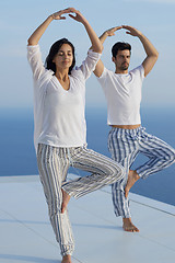 Image showing young couple practicing yoga