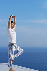 Image showing young man practicing yoga