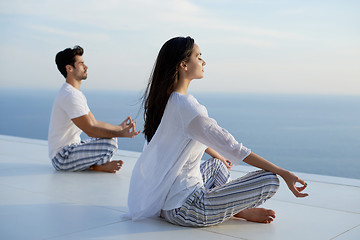 Image showing young couple practicing yoga