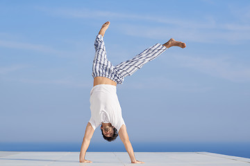 Image showing young man practicing yoga