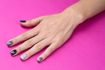 Image showing Delicate female hand with a stylish neutral manicure